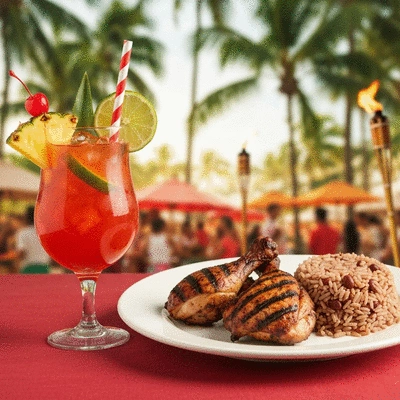 A vibrant rum punch cocktail with tropical garnishes next to a plate of jerk chicken and rice and peas